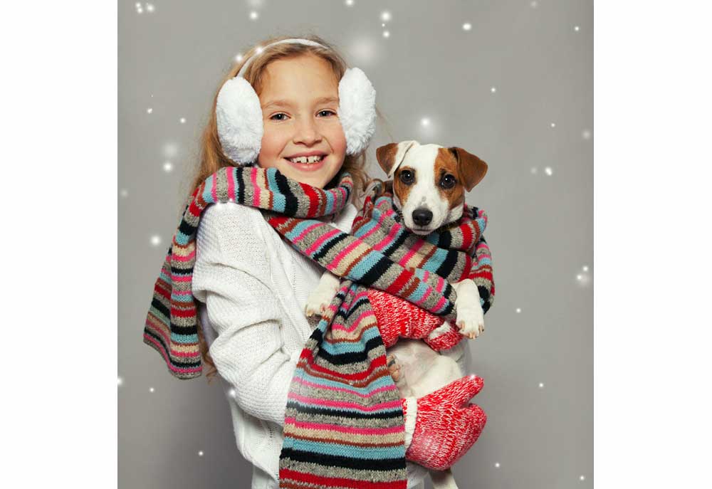 Studio Image of a Terrier Dog and a Girl Dressed for Winter | Dog Photography